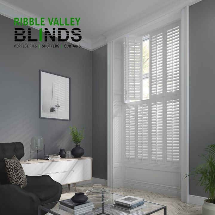 Custom white plantation shutters installed in a Ribble Valley living room